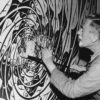 M.C. Escher malt eines seiner Kunstwerke
