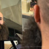 Bild eines Mannes mit Bart der in den Spiegel schaut