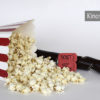 Plakat zu den Kinostarts. Umgefallen Popcorntüte